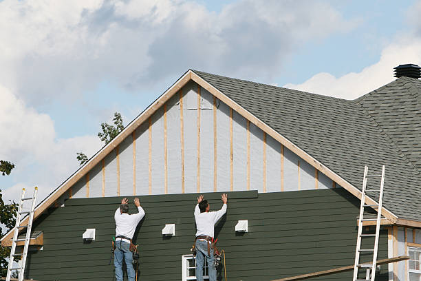 Professional Siding technician working in Lawrence, MA